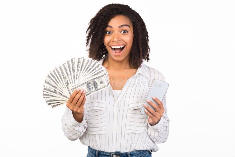 Happy black woman holding money and iPhone 11 pro max