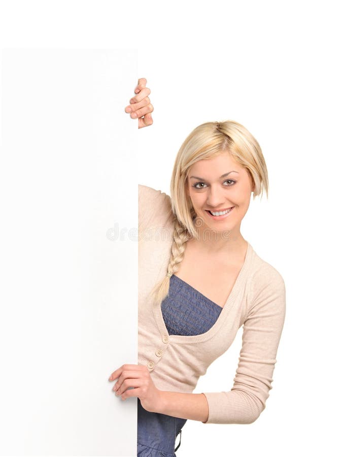 Happy blond woman holding a blank billboard