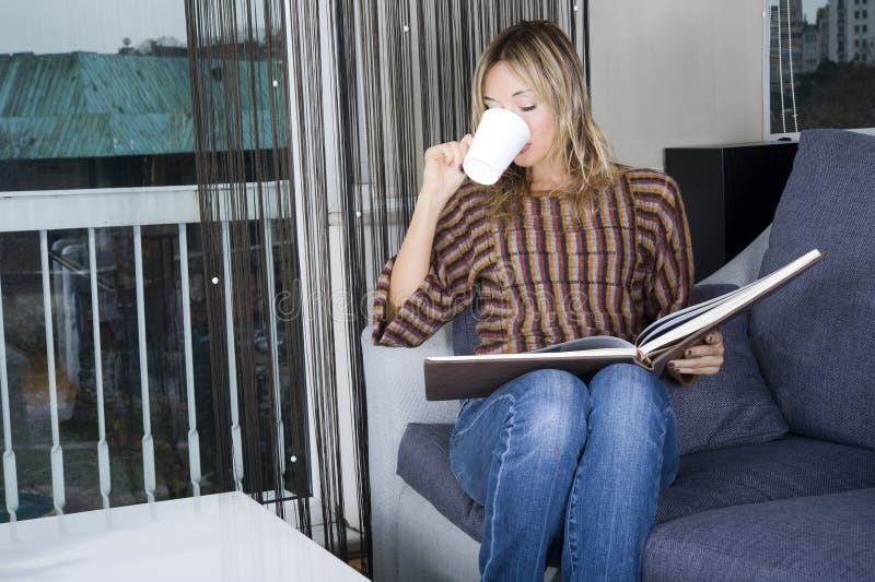 Happy blond woman at home