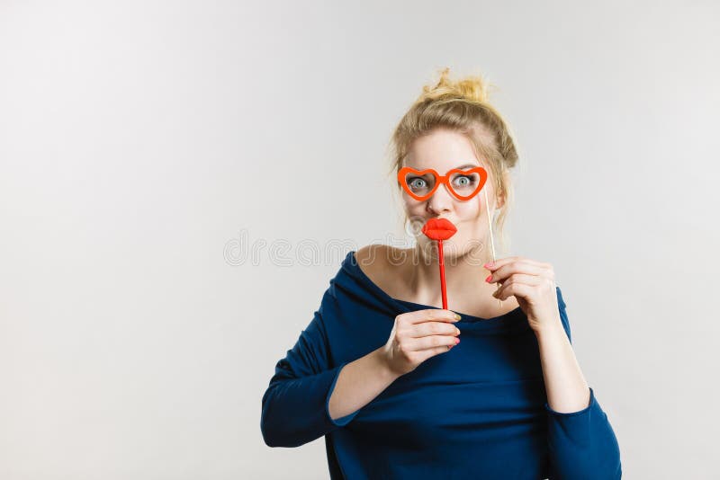 Woman Holds Carnival Accessories On Stick Stock Photo Image Of