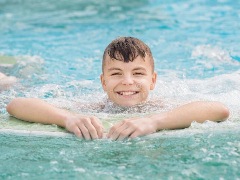 Smiling Teen Boy Swimming In Pool Royalty Free Stock Image 