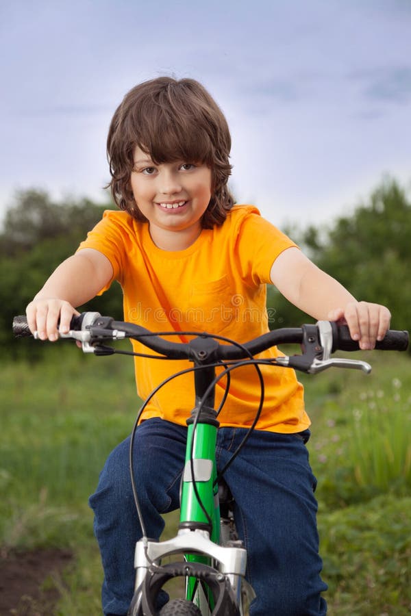 Happy Boy Ride Bikes Outdoors Stock Image - Image of lifestyles, nature ...