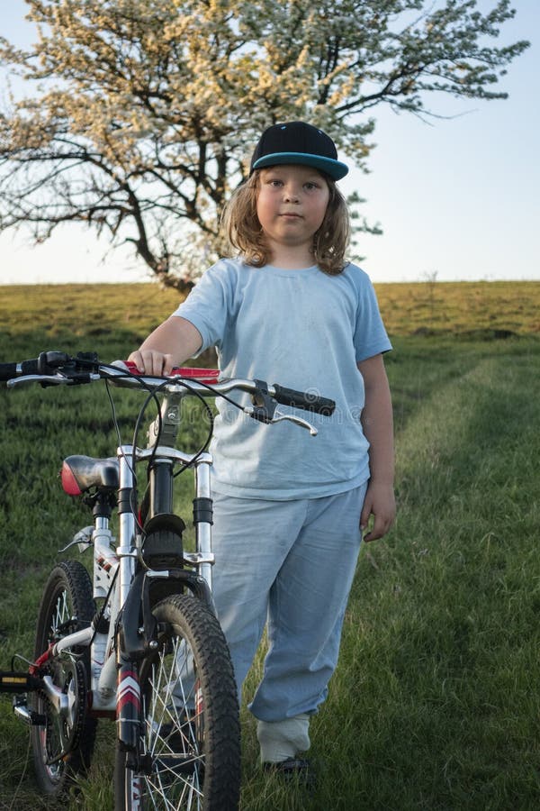Happy boy ride bikes outdoors stock photos Happy boy ride bikes outdoors stock photos