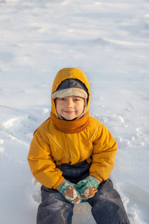 Happy boy in snow play and smile sunny day outdoors stock photo Happy boy in snow play and smile sunny day outdoors stock photo