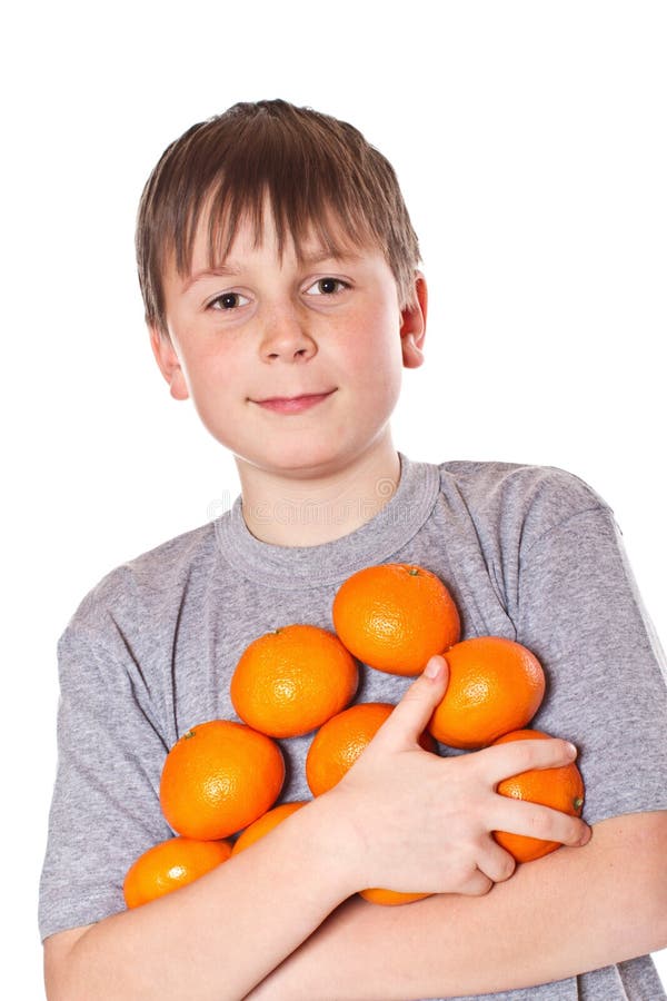 Happy boy with tangerines