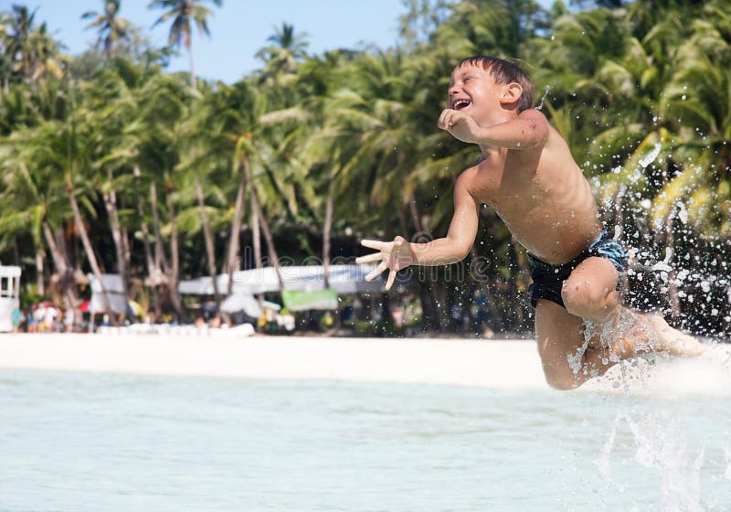 Happy boy in water