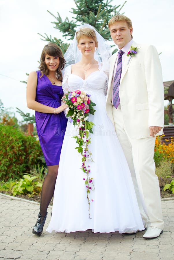 Happy bridal party outside during a wedding