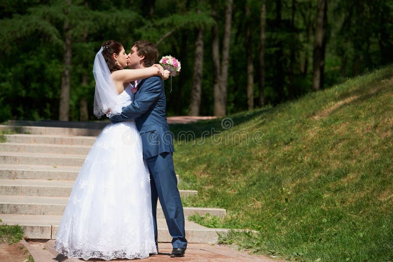 Happy Bride and groom kissing