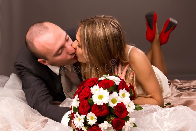 Happy bride and groom kissing