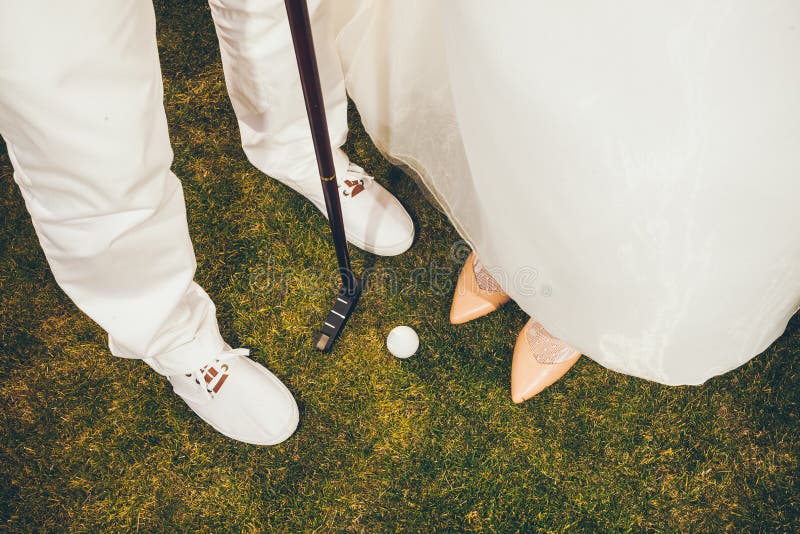 Happy Bride and Groom playing golf - Close up wedding royalty free stock photo Happy Bride and Groom playing golf - Close up wedding royalty free stock photo