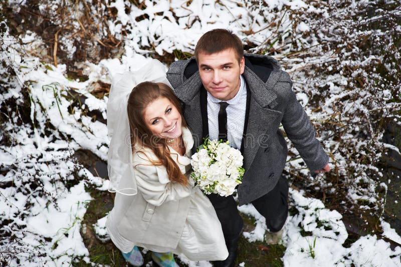 Happy bride and groom in winter day