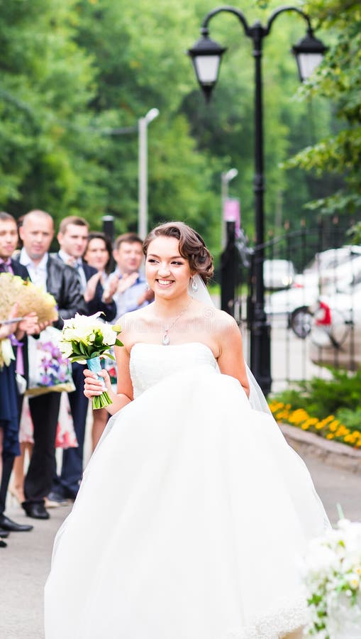Happy bride with guests royalty free stock image