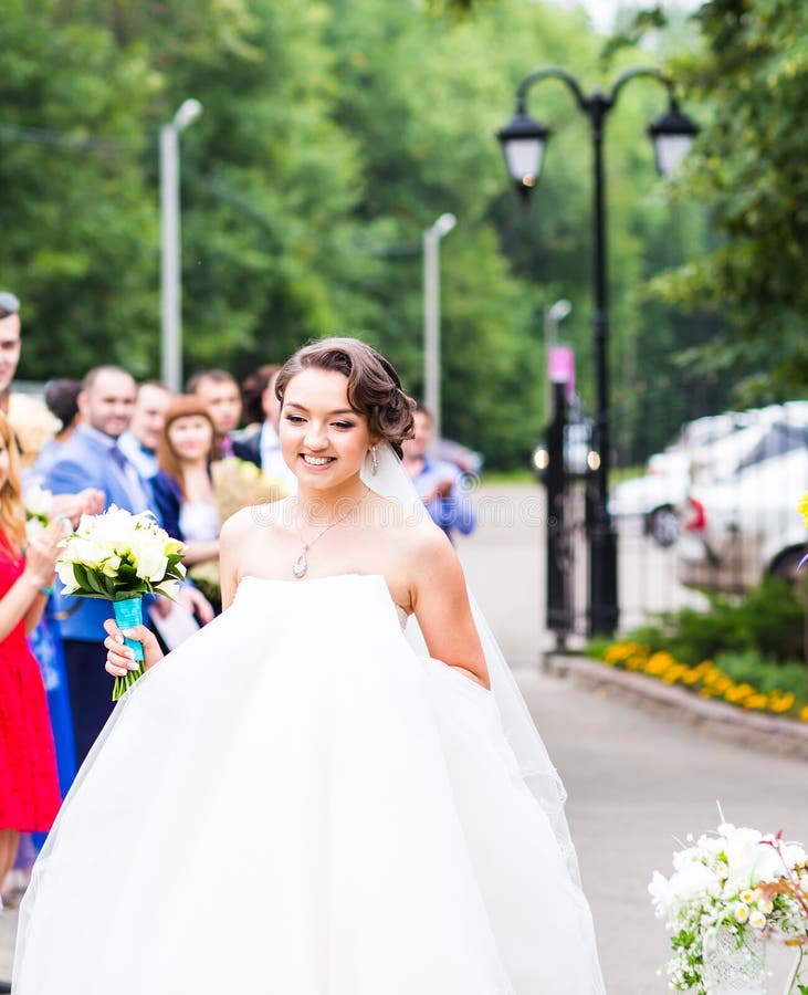 Happy bride with guests stock images