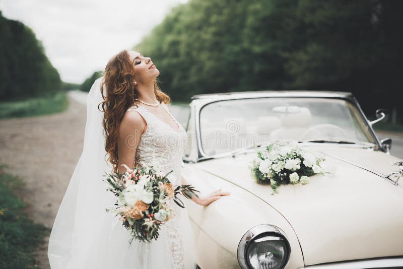 Happy Bride in the Retro Car Posing on Her Weeding Day Stock Image