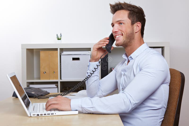 Happy business man in office making royalty free stock photography Happy business man in office making royalty free stock photography