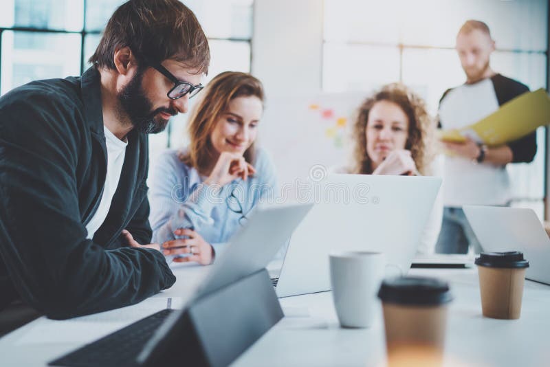 Happy business team making conversation at sunny meeting room.Horizontal.Blurred background. royalty free stock photo Happy business team making conversation at sunny meeting room.Horizontal.Blurred background. royalty free stock photo