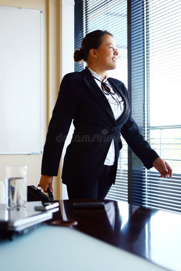 Happy business woman in the office