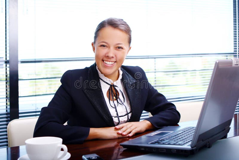 Happy business woman in the office