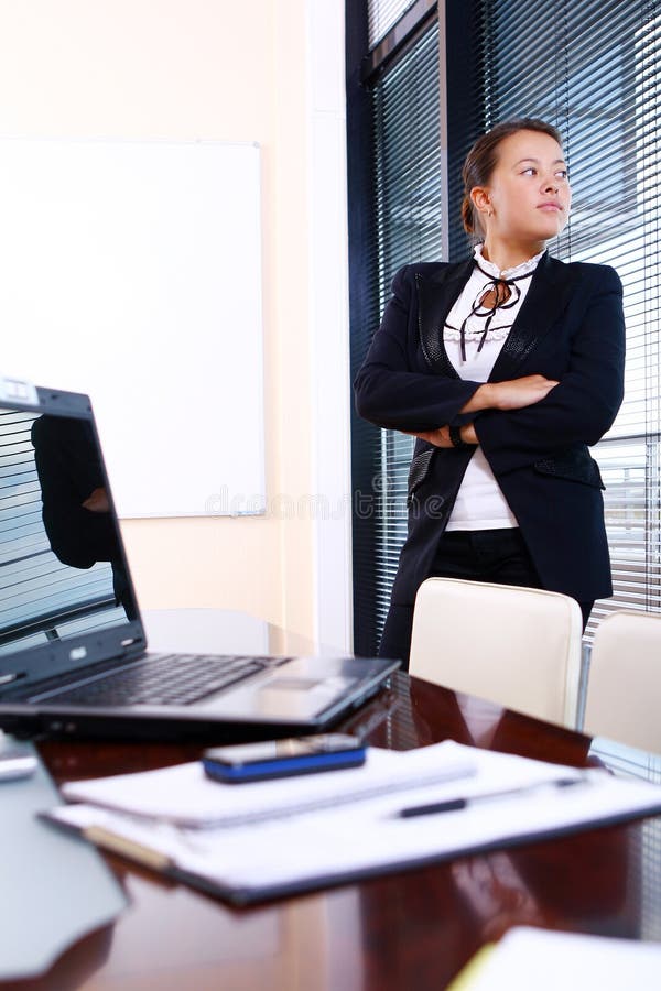 Happy business woman in the office