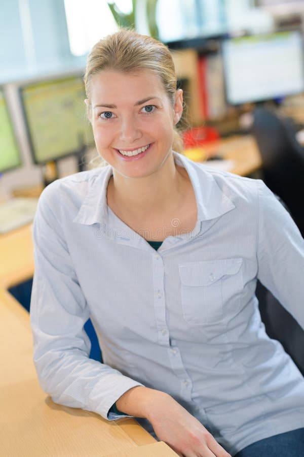 Happy business woman at office smiling royalty free stock photo