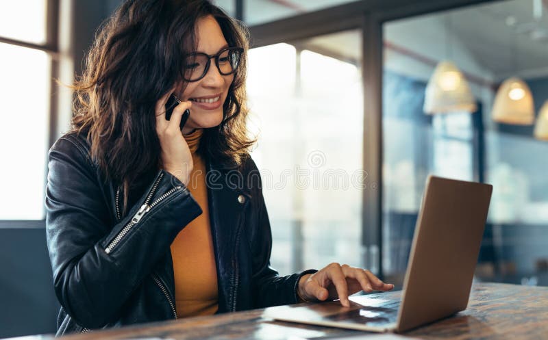 Happy business woman working at the desk stock photos
