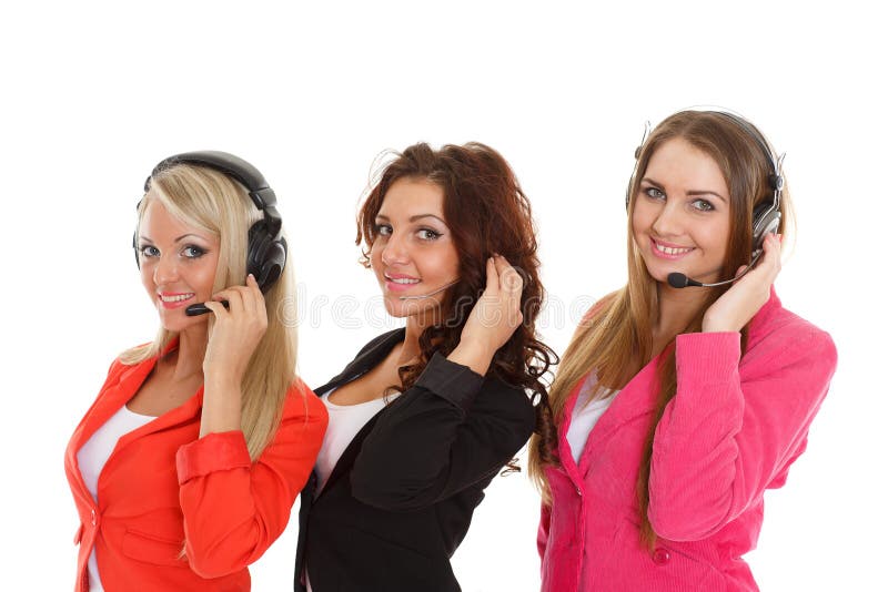 Happy young business women with headset on a white background. Operators of support service. Happy young business women with headset on a white background. Operators of support service.