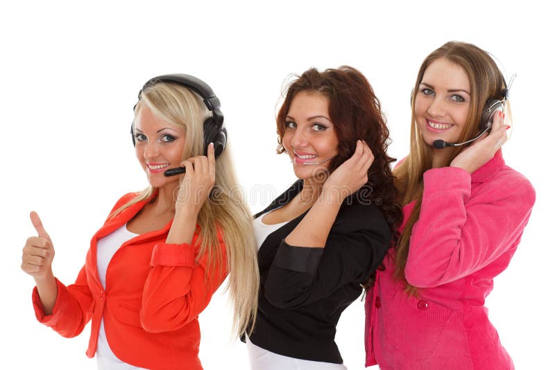Happy young business women with headset on a white background. Operators of support service. Happy young business women with headset on a white background. Operators of support service.