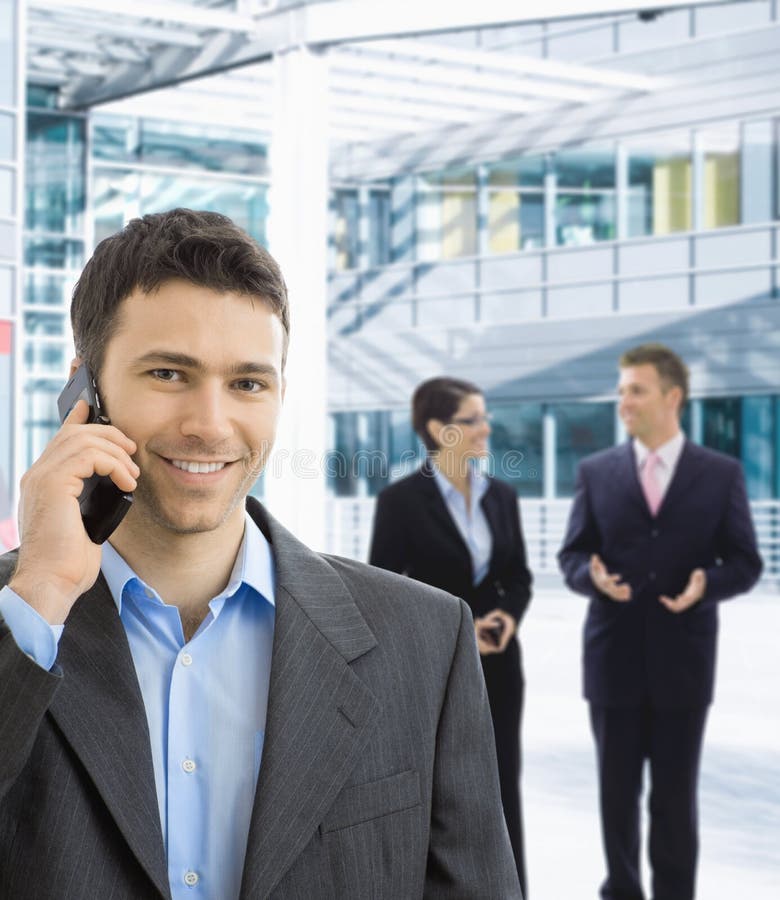 Happy businessman talking on mobile stock images