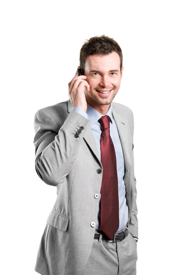 Happy businessman talking on mobile royalty free stock image