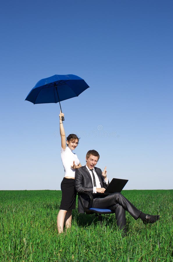 Happy businessmen working on laptop