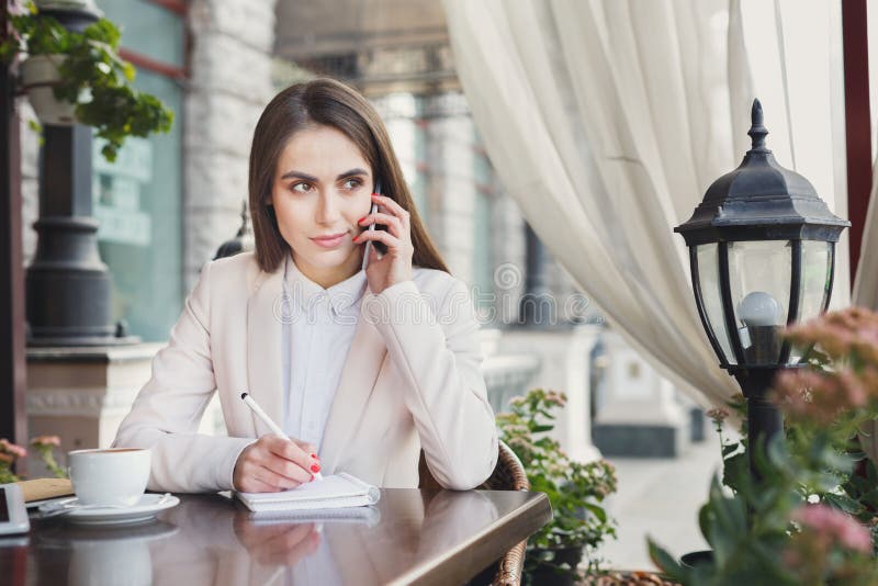 Young businesswoman talking on smartphone stock image Young businesswoman talking on smartphone stock image
