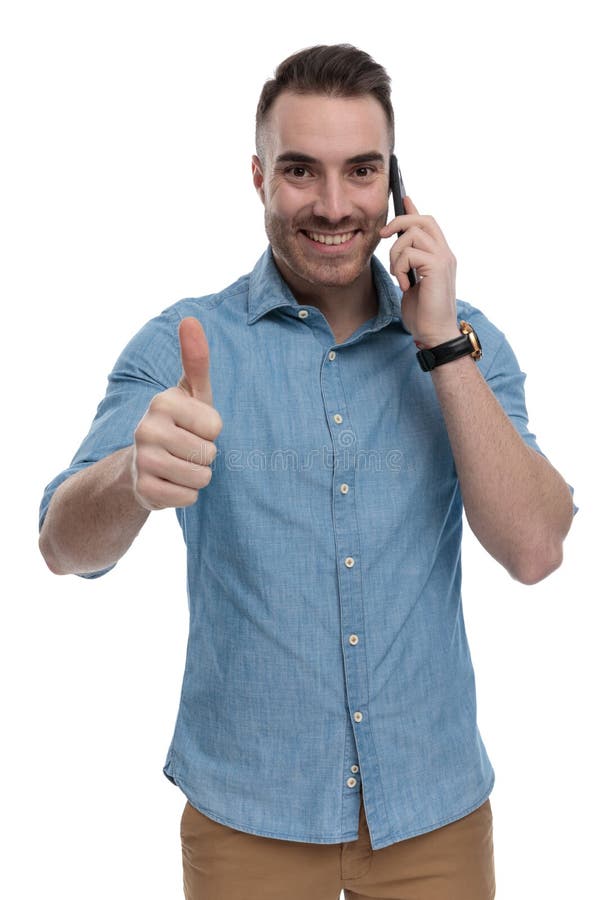 Happy casual man talking on phone, laughing and gesturing ok
