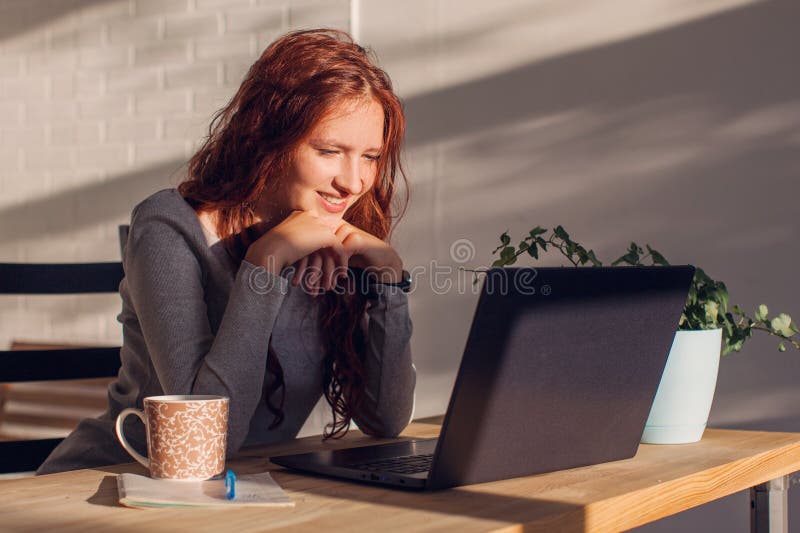 happy-caucasian-teen-high-school-student-studying-laptop-books-doing-online-research-homework-assignment-smiling-teenage-girl-255300624.jpg