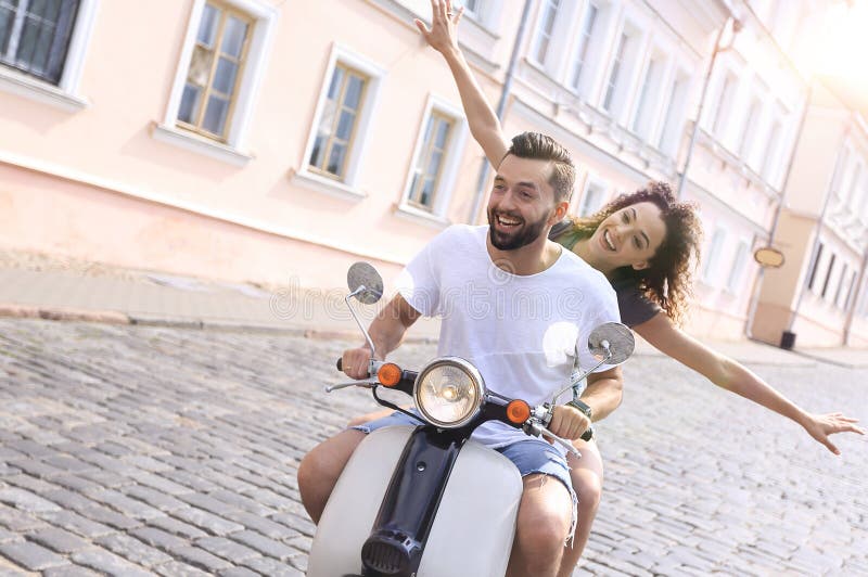 Happy Young Couple Having Fun on a Scooter Stock Image - Image of ...
