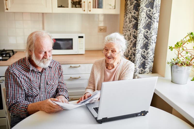 jpg sitting at kitchen table worried about expenses jpg