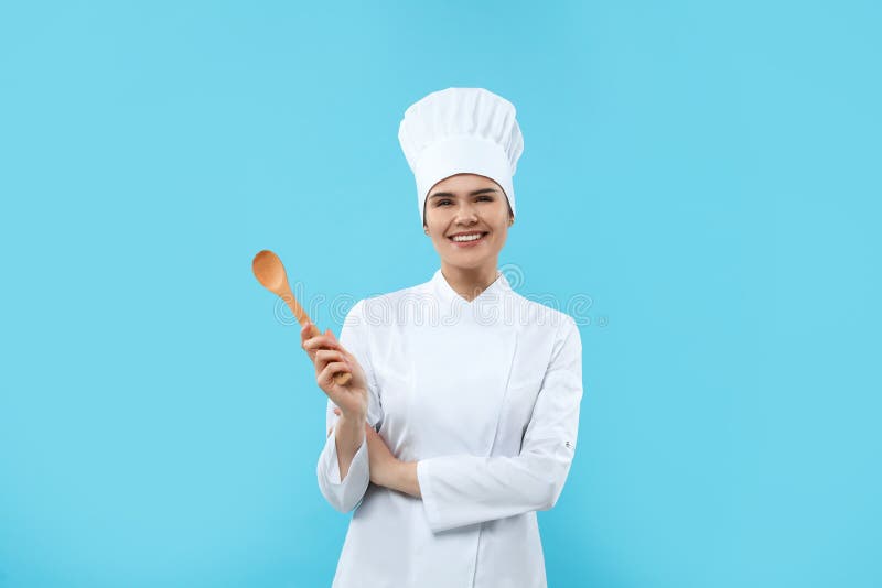 Happy Chef with Wooden Spoon on Light Blue Background Stock Image