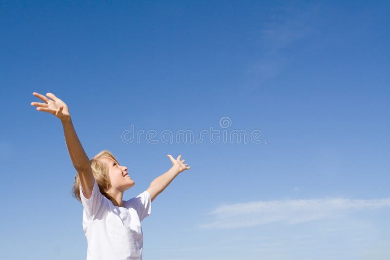 Happy child arms raised stock photo