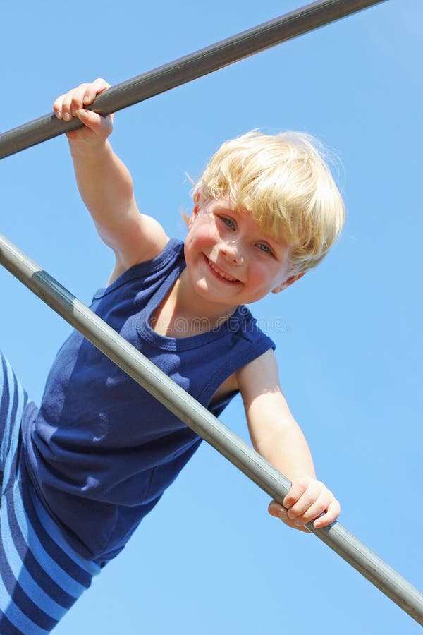 Happy Child Climbing at Playground
