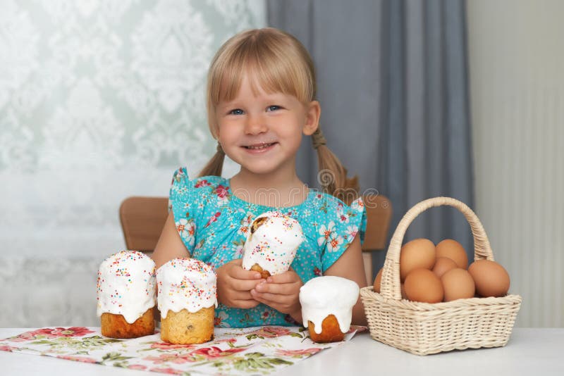 Happy Child Eating Easter Cake and Eggs Stock Photo Image of