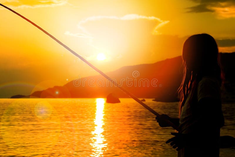 Happy child fishing by the sea silhouette royalty free stock photo Happy child fishing by the sea silhouette royalty free stock photo