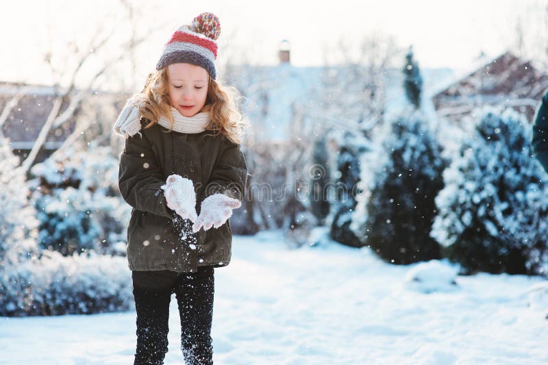 Happy Child Girl Playing with Snow on Snowy Winter Walk on Backyard ...