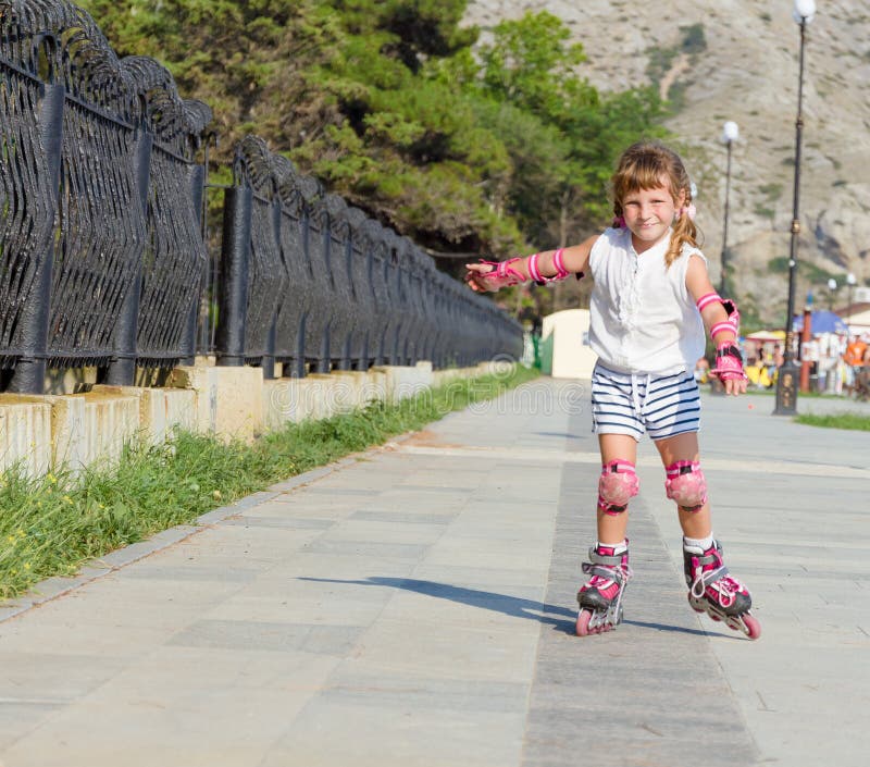 Happy Child Girl Roller Skating Stock Photo Image of enjoy, childhood