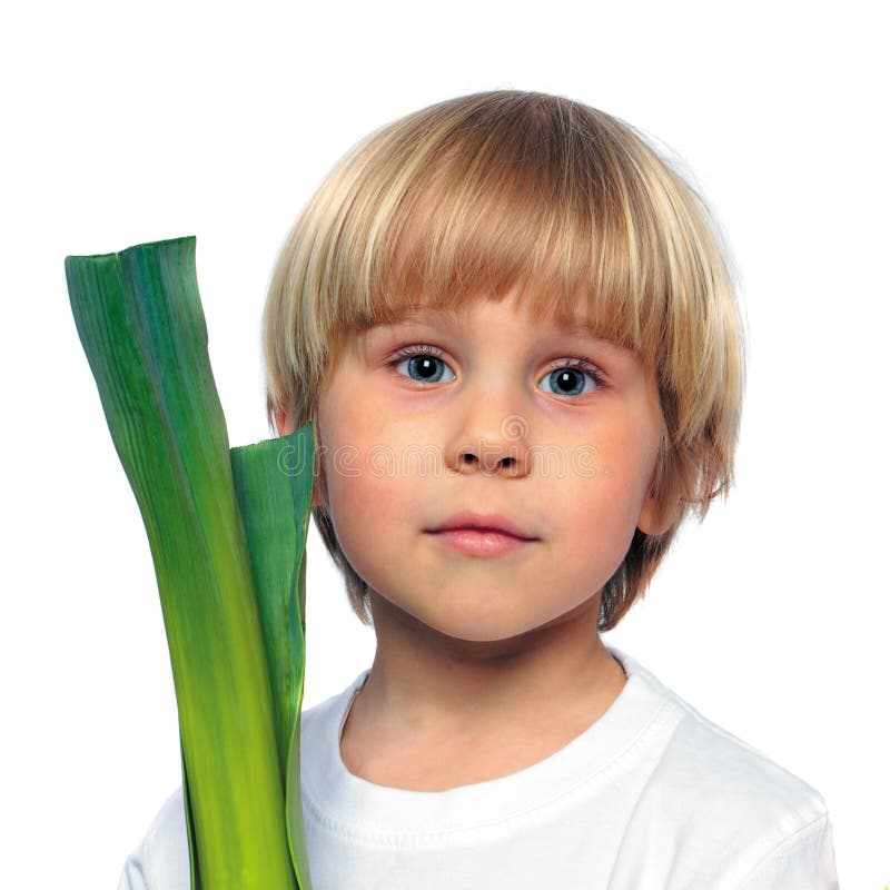 Happy child with green vegetable