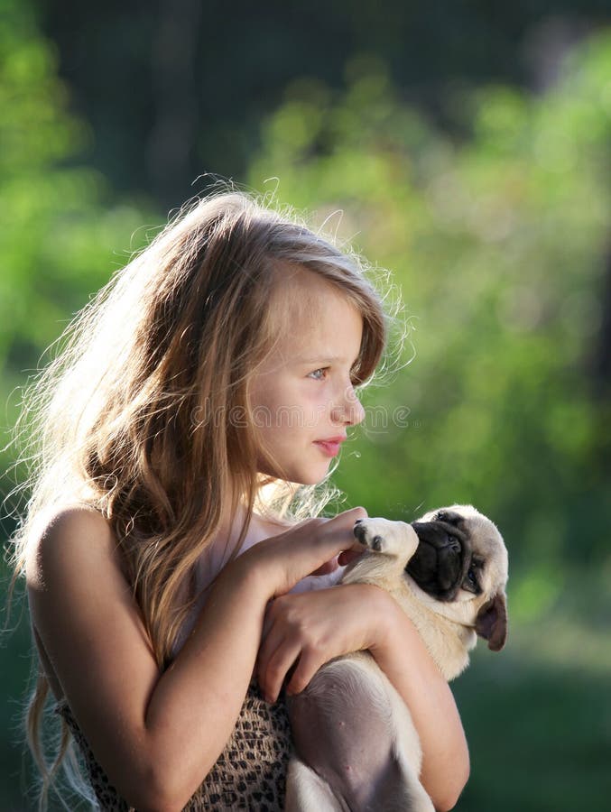 Happy Child Holding a Small Dog Stock Photo - Image of face, mops: 28188258