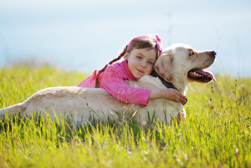 Happy child playing with dog