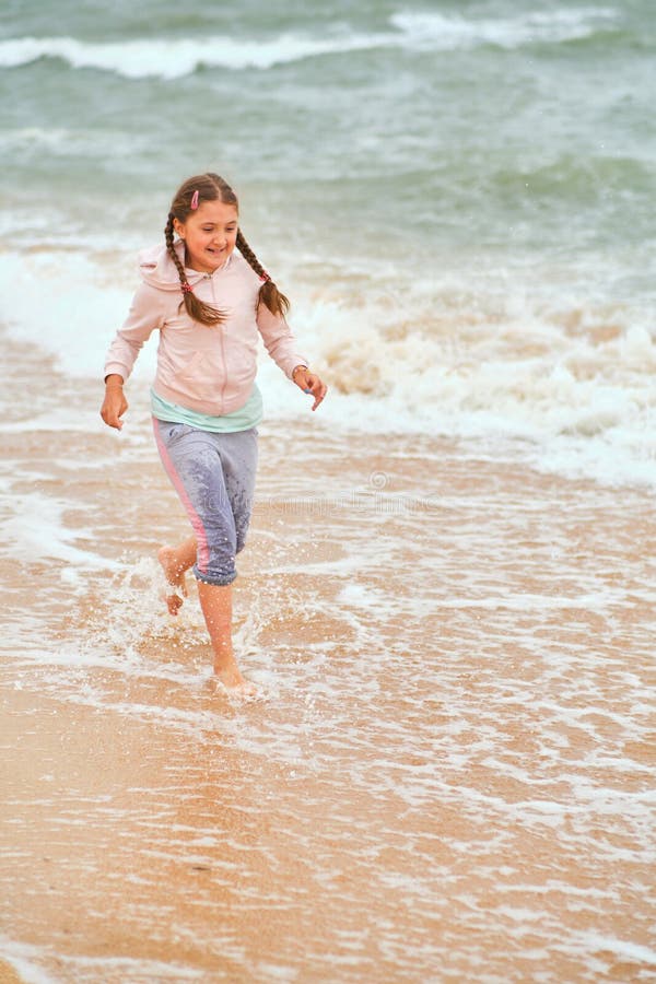 Happy Child Playing in the Sea Stock Image - Image of happiness, light ...