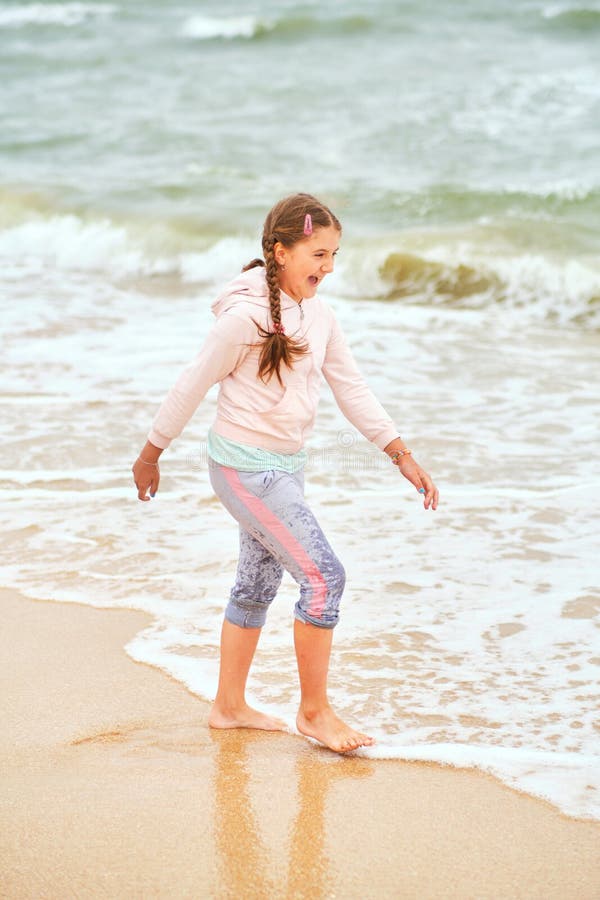 Happy Child Playing in the Sea Stock Image - Image of enjoy, light ...