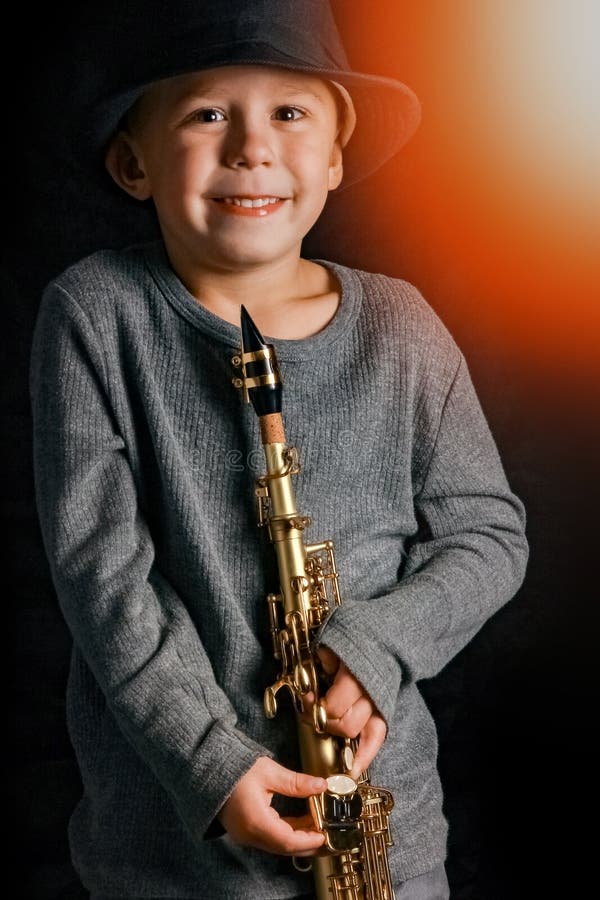 Happy Child Plays Saxophone in Studio Stock Photo Image of person