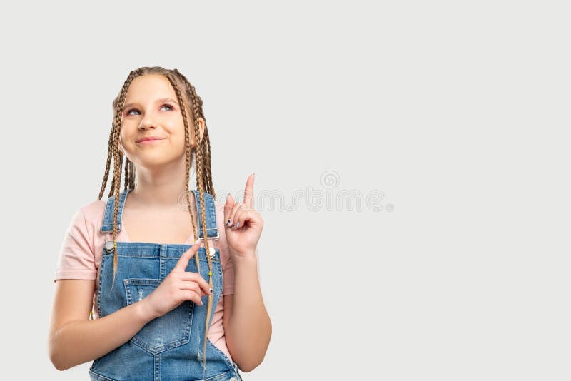 Happy child portrait girl pointing empty space