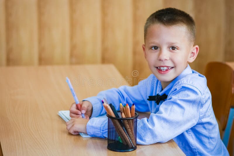 A Happy Child at School Desk at School after School Stock Photo Image